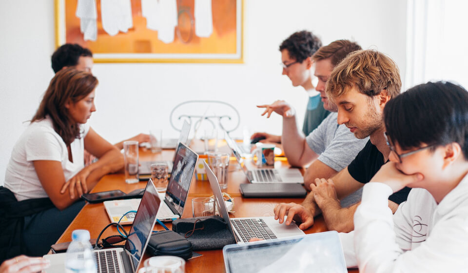 employees in conference room discussion